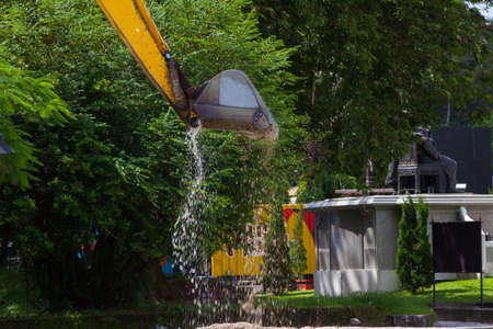 Excavator with metal tracks at construction site 