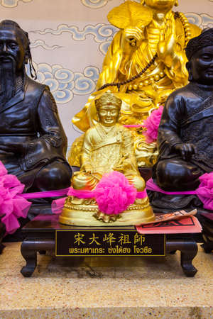 Golden statue of a Chinese god in Chinese temple Ranong,Thailandのeditorial素材