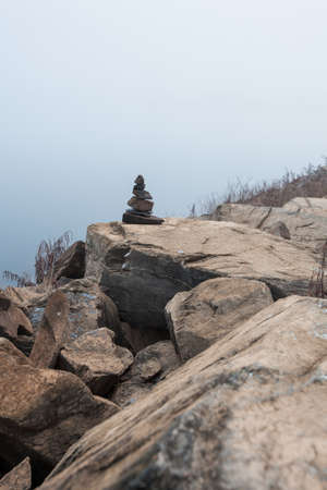 Pile of pebble Stones at the Foggy damsの写真素材