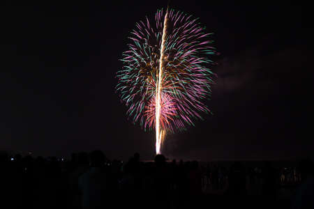 Brightly colorful fireworks and salute of various colors in the nightの写真素材