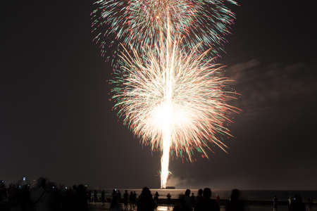 Brightly colorful fireworks and salute of various colors in the nightの写真素材