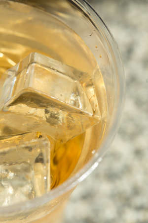 Whiskey with ice in Disposable Cupの写真素材