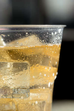 cold beer with ice in Disposable Cup
