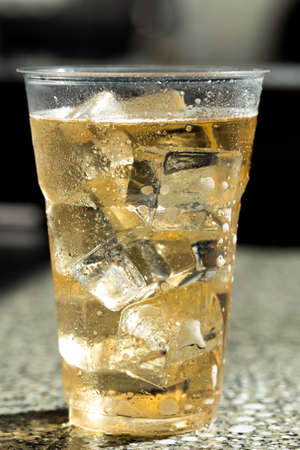 cold beer with ice in Disposable Cupの写真素材