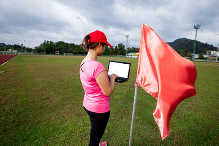 sports women using laptop checking