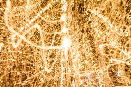 Gold lights abstact background in night timeの写真素材