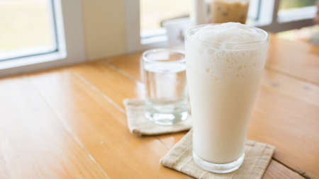 milkshake on a wooden table.の写真素材