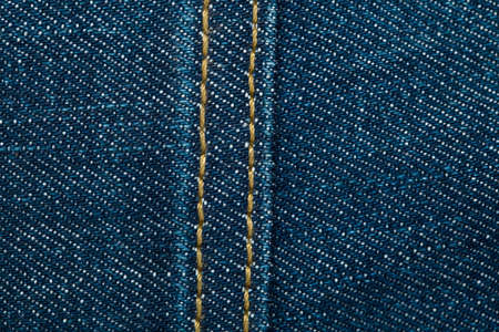 Blue denim jeans texture with seam