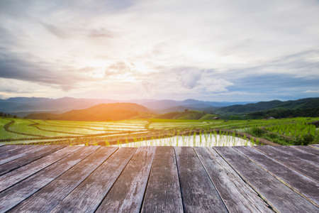 wooden floor and Blured Agriculture terrace rice fields on the mountain