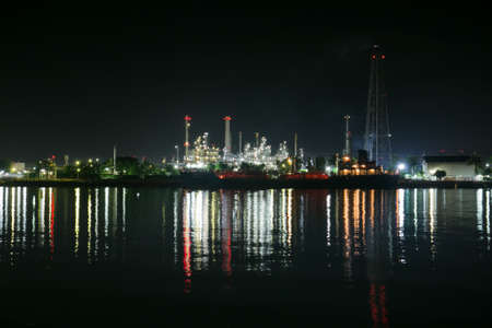 Oil refinery Riverside and Water reflection.の写真素材