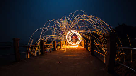 Fire spinning from steel wool.