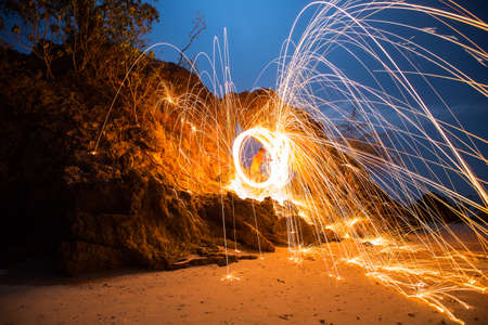 Fire spinning from steel wool.の写真素材