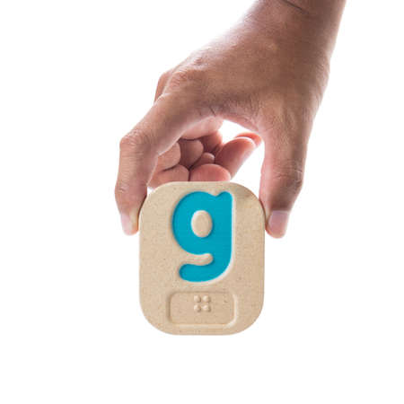 Hand holding  Wooden Block on white background.の写真素材