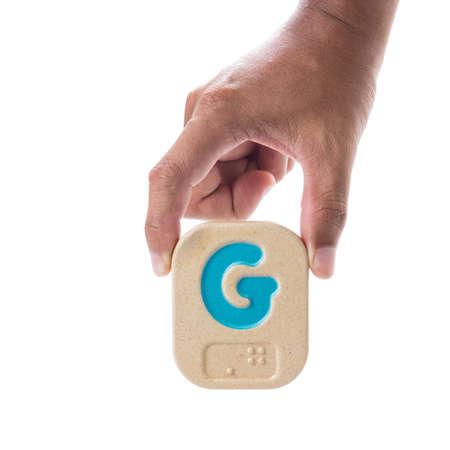 Hand holding  Wooden Block on white background.の写真素材