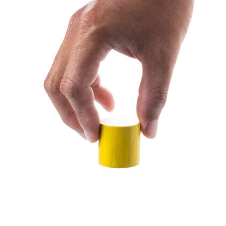 Hand holding  Wooden Block on white background.の写真素材
