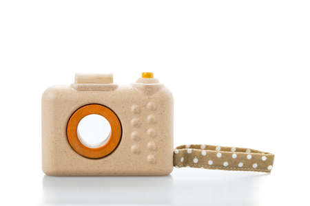 wooden toy camera on white background.の写真素材