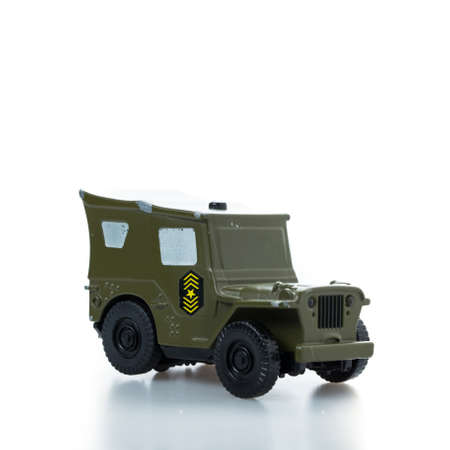 metal toy race car damaged on white background.の写真素材
