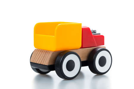 wooden toy race car on white background.の写真素材