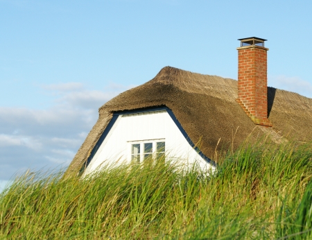 House behind the dikeの写真素材
