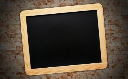 Chalkboard on Stone Wall Backgroundの写真素材