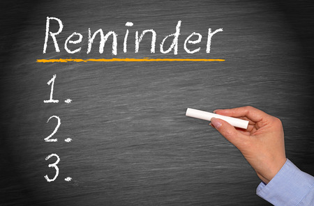 Reminder on black boardの写真素材