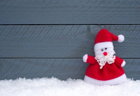 Merry Christmas - Santa Claus on wooden backgroundの写真素材