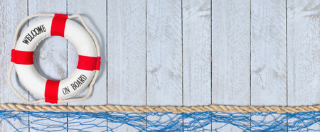 Welcome on Board - lifebuoy on horizontal wooden backgroundの写真素材
