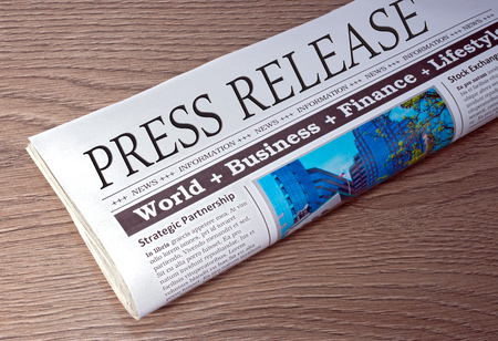 Press Release - Newspaper on desk in the Officeの写真素材