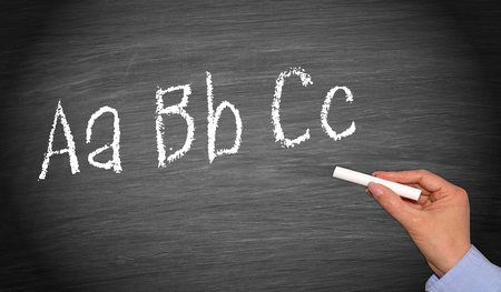 Writing ABC on chalkboard or blackboardの写真素材