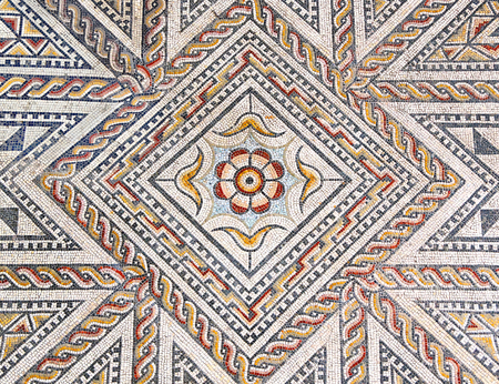 Ancient roman stone mosaic floor with geometric designの写真素材