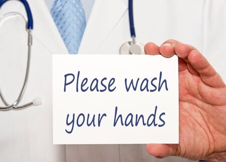 Please wash your hands, medical doctor with signの写真素材