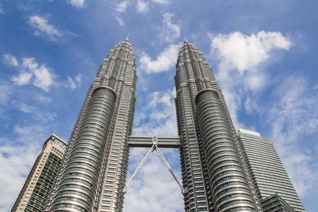 KUALA LUMPUR,MALAYSIA - JUNE 14, 2013: The Petronas Towers,Petronas Twin Towers are twin skyscrapers...