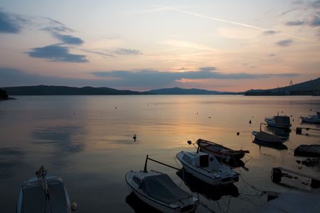 Quiet twilight at the bay full of small boatsの写真素材