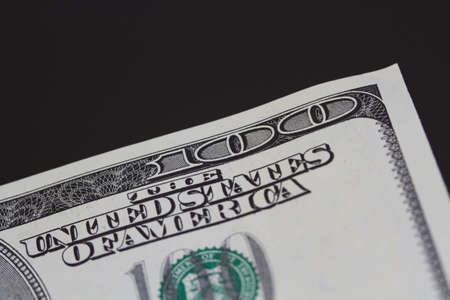 One hundred dollars close-up  black background