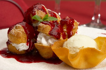 Tasty profiteroles on a dining table...