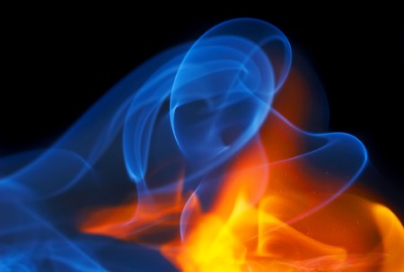 Photo of fire with a smoke on a black background の写真素材