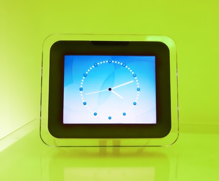 Blue electronic hours, on a green background...