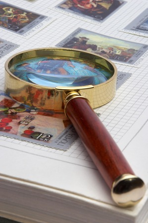 Magnifier and album for stamps の写真素材