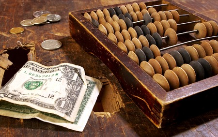 One dollar on an old table with accounts 