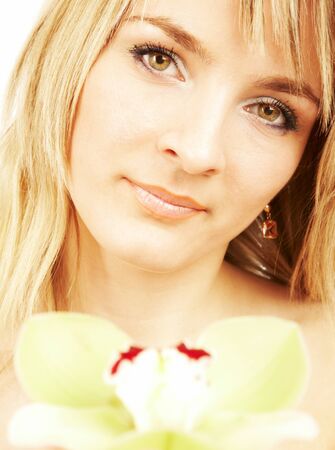 Portrait of the girl with an orchid...の写真素材
