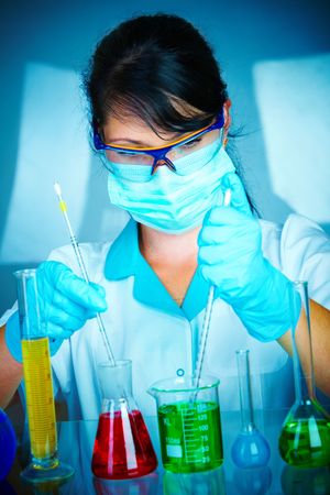 Young scientist in laboratory with test tubesの写真素材