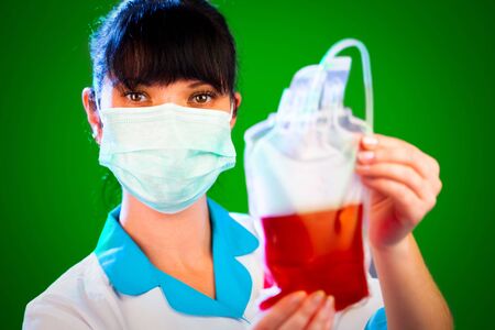 doctor with a package of donor bloodの写真素材