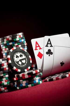 Stack of chips and two aces