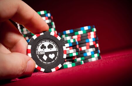 Casino gambling chips on the red