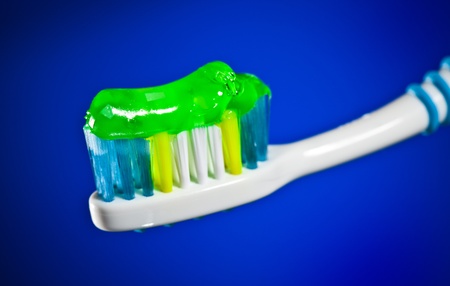 White toothbrush on a dark blue background