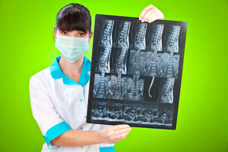 Doctor with xray on a green background