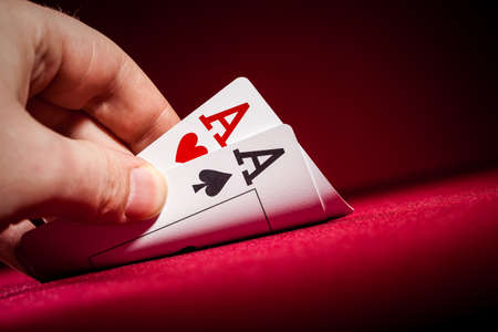 Stack of chips and two aces