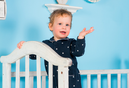 Baby playing on bedの写真素材