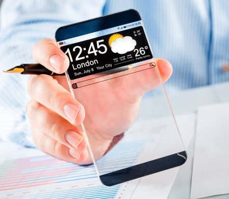 Smart phone (phablet) with a transparent display in human hands. Concept actual future innovative ideas and best technologies humanity.の写真素材