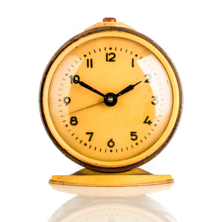 Old clock on a white backgroundの写真素材